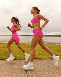 Woman wearing Accelerate 3" Running Short - Ultra Pink | Model:Duo | Size:Both