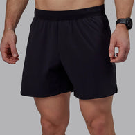 Man wearing LSKD shorts in black