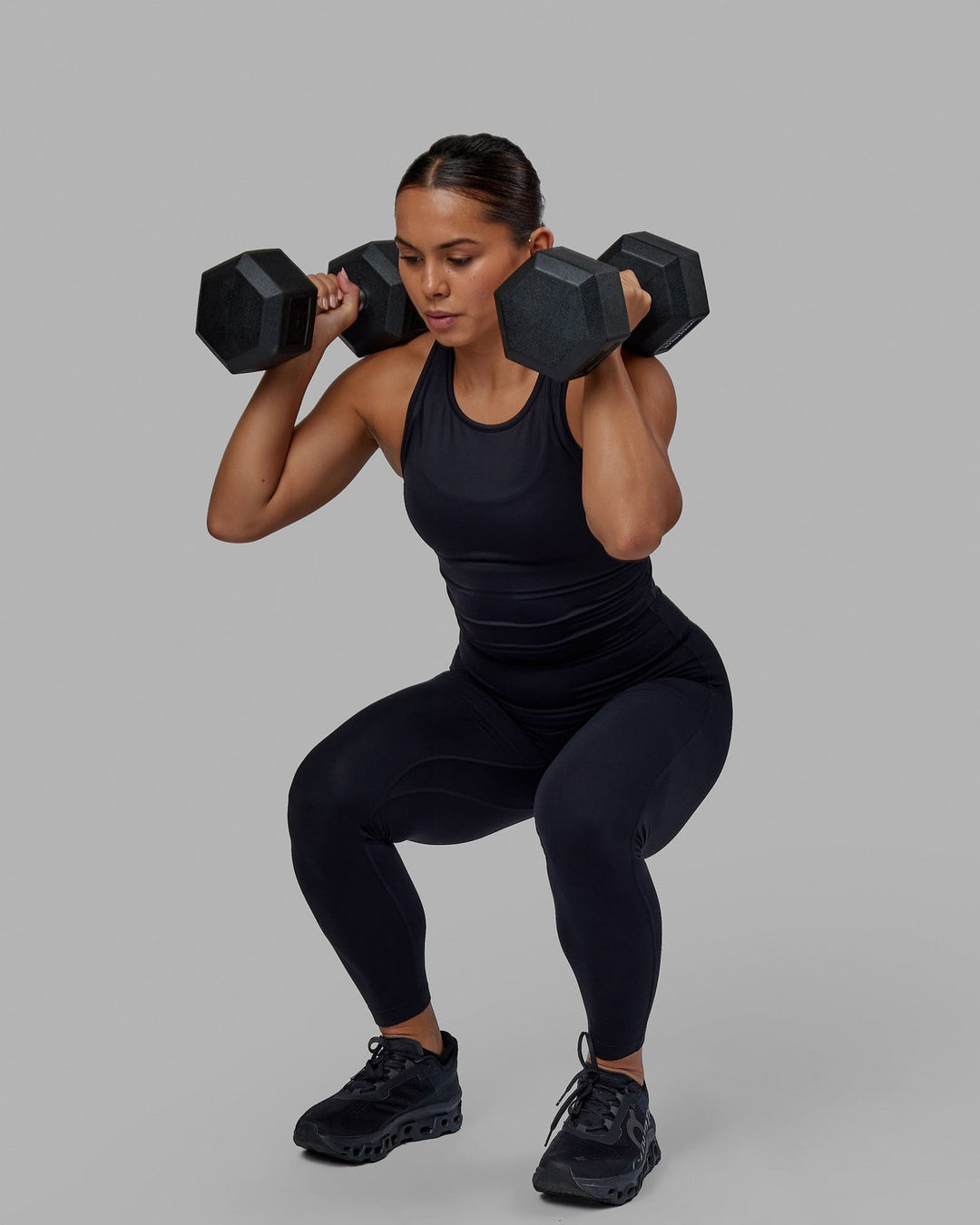 Woman wearing Flow Performance Tank - Black