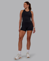 Woman wearing Flow Performance Tank - Black | Model:Phoebe | Size:S