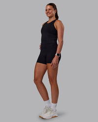 Woman wearing Flow Performance Tank - Black | Model:Phoebe | Size:S