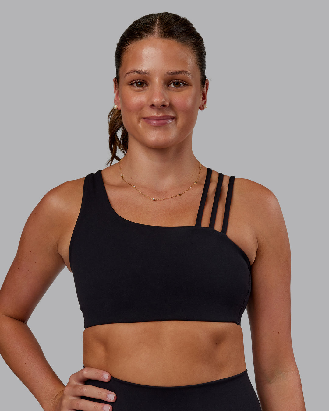 Woman wearing Galvanise Sports Bra 2.0 - Black | Set:true | Angle:front | Model:Phoebe | Size:S
