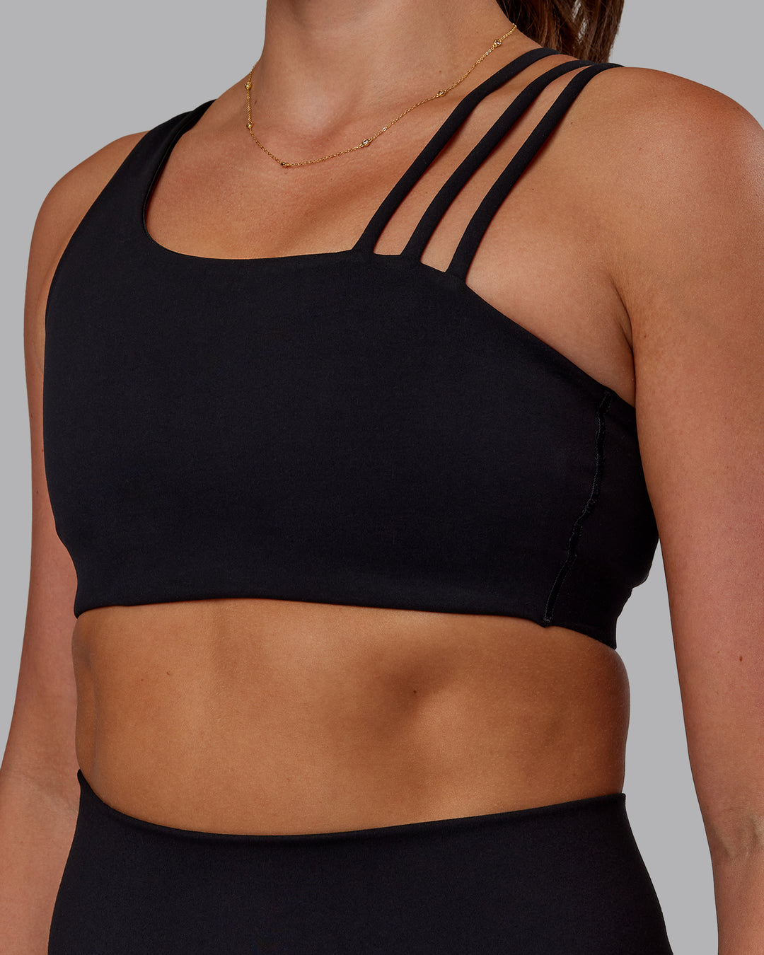 Woman wearing Galvanise Sports Bra 2.0 - Black | Set:true | Angle:closeup | Model:Phoebe | Size:S