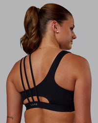 Woman wearing Galvanise Sports Bra 2.0 - Black | Set:true | Angle:black | Model:Phoebe | Size:S