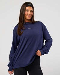Woman wearing Go-To Long Sleeve FLXCotton Oversized Tee - Future Navy-White | Model:Bianca | Size:S