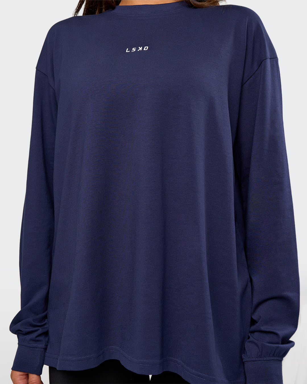 Woman wearing Go-To Long Sleeve FLXCotton Oversized Tee - Future Navy-White | Model:Bianca | Size:S