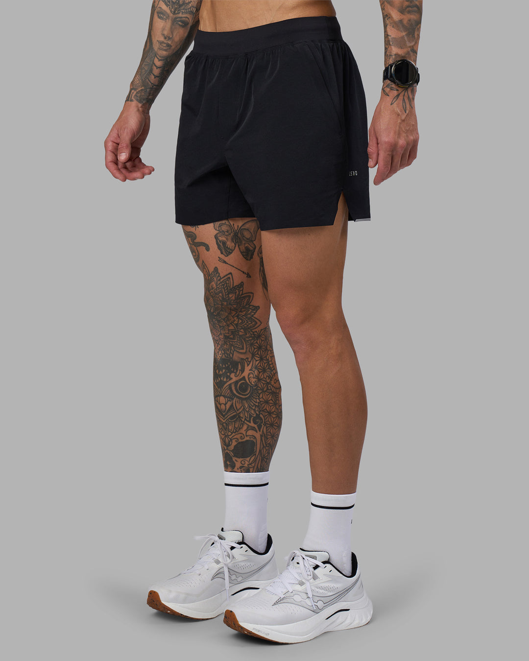 Man wearing Hybrid 5" Short - Black-Reflective | Model:Tommy | Size:S