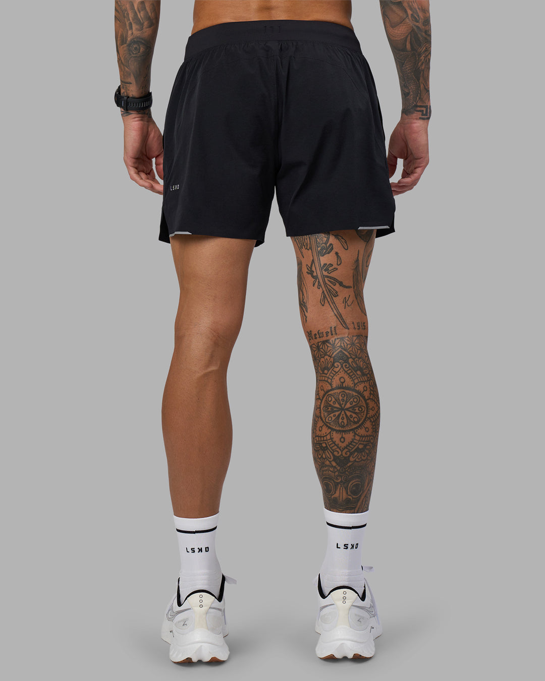 Man wearing Hybrid 5" Short - Black-Reflective | Model:Tommy | Size:S