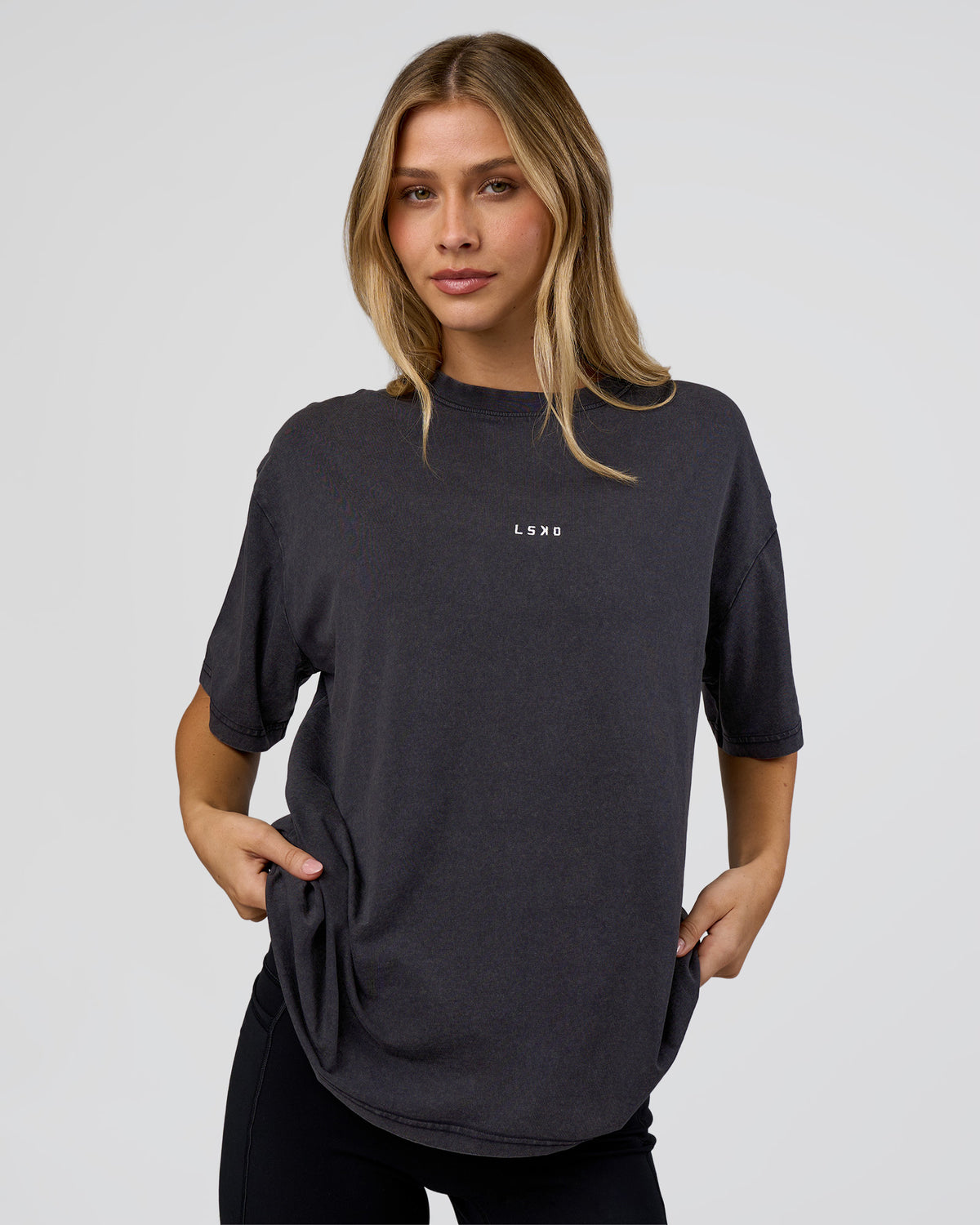 Woman wearing Go-To FLXCotton Oversized Tee - Black Washed-White | Model:Leilani | Size:S