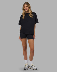 Woman wearing Go-To FLXCotton Oversized Tee - Black-White | Model:Leilani | Size:XS