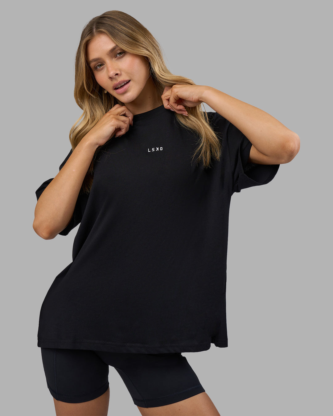 Woman wearing Go-To FLXCotton Oversized Tee - Black-White | Model:Leilani | Size:XS